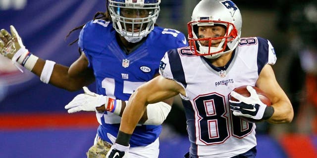 New England Patriots' Danny Amendola (80) runs away from New York Giants' Dwayne Harris (17) during the second half of an NFL football game Sunday, Nov. 15, 2015, in East Rutherford, N.J. (AP Photo/Gary Hershorn)