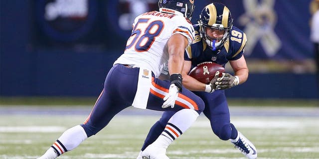 Nov 15, 2015; St. Louis, MO, USA; St. Louis Rams wide receiver Wes Welker (19) catches a pass for a first down as Chicago Bears outside linebacker Jonathan Anderson (58) closes in for the tackle during the second half at the Edward Jones Dome. The Bears won the game 37-13. Mandatory Credit: Billy Hurst-USA TODAY Sports
