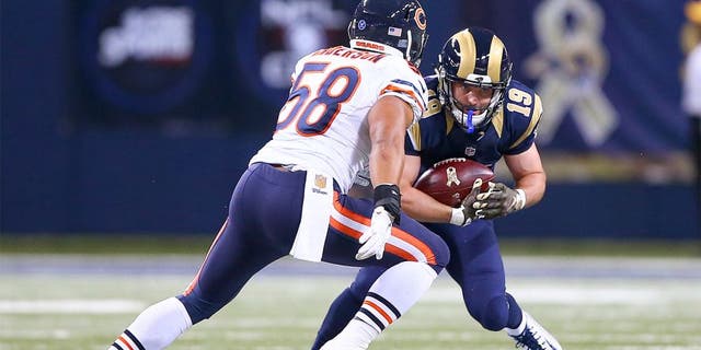 Nov 15, 2015; St. Louis, MO, USA; St. Louis Rams wide receiver Wes Welker (19) catches a pass for a first down as Chicago Bears outside linebacker Jonathan Anderson (58) closes in for the tackle during the second half at the Edward Jones Dome. The Bears won the game 37-13. Mandatory Credit: Billy Hurst-USA TODAY Sports