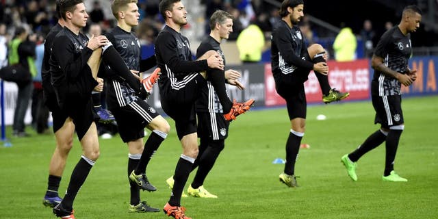 Germany's national football team warms up prior to a friendly international football match between France and Germany ahead of the Euro 2016, on November 13, 2015 at the Stade de France stadium in saint-Denis, north of Paris. AFP PHOTO / MIGUEL MEDINA (Photo credit should read MIGUEL MEDINA/AFP/Getty Images)