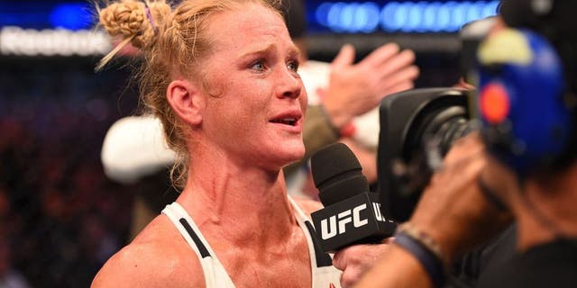 MELBOURNE, AUSTRALIA - NOVEMBER 15: Holly Holm is interviewed by Joe Rogan after her second round KO (head kick and punches) against Ronda Rousey (not pictured) to win their UFC women's bantamweight championship bout during the UFC 193 event at Etihad Stadium on November 15, 2015 in Melbourne, Australia. (Photo by Josh Hedges/Zuffa LLC/Zuffa LLC via Getty Images)