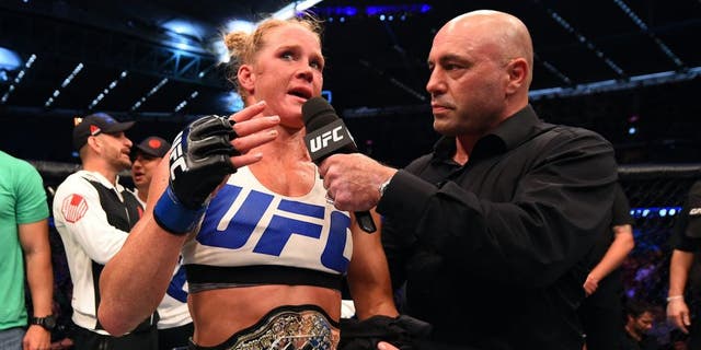 MELBOURNE, AUSTRALIA - NOVEMBER 15: Holly Holm is interviewed by Joe Rogan after her second round KO (head kick and punches) against Ronda Rousey (not pictured) to win their UFC women's bantamweight championship bout during the UFC 193 event at Etihad Stadium on November 15, 2015 in Melbourne, Australia. (Photo by Josh Hedges/Zuffa LLC/Zuffa LLC via Getty Images)