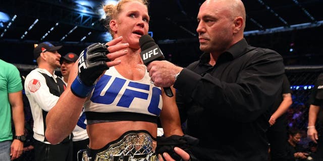 MELBOURNE, AUSTRALIA - NOVEMBER 15: Holly Holm is interviewed by Joe Rogan after her second round KO (head kick and punches) against Ronda Rousey (not pictured) to win their UFC women's bantamweight championship bout during the UFC 193 event at Etihad Stadium on November 15, 2015 in Melbourne, Australia. (Photo by Josh Hedges/Zuffa LLC/Zuffa LLC via Getty Images)