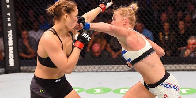 MELBOURNE, AUSTRALIA - NOVEMBER 15: Holly Holm (R) lands a punch against Ronda Rousey (L) in their UFC women's bantamweight championship bout during the UFC 193 event at Etihad Stadium on November 15, 2015 in Melbourne, Australia. (Photo by Josh Hedges/Zuffa LLC/Zuffa LLC via Getty Images)