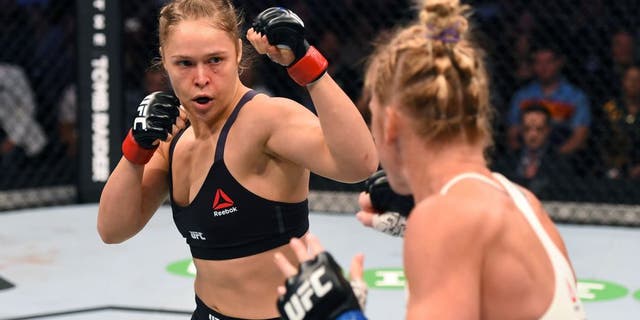 MELBOURNE, AUSTRALIA - NOVEMBER 15: (L-R) Ronda Rousey and Holly Holm size each other up in the first round in their UFC women's bantamweight championship bout during the UFC 193 event at Etihad Stadium on November 15, 2015 in Melbourne, Australia. (Photo by Josh Hedges/Zuffa LLC/Zuffa LLC via Getty Images)