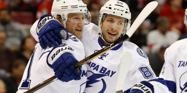 Tampa Bay Lightning center Steven Stamkos, left, celebrates his goal against the Detroit Red Wings with Nikita Kucherov in the first period of an NHL hockey game Tuesday, Nov. 15, 2016 in Detroit. (AP Photo/Paul Sancya)