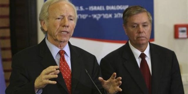 Nov. 16, 2009: Sen. Joe Lieberman, I-Conn., talks as Sen. Lindsey Graham, R-S.C., listens during a press conference at the Saban Forum in Jerusalem (AP).