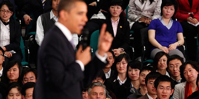 Nov. 16: Audience members listen as President Obama speaks at a town hall style event with Chinese youth at the Museum of Science and Technology in Shanghai. (AP)