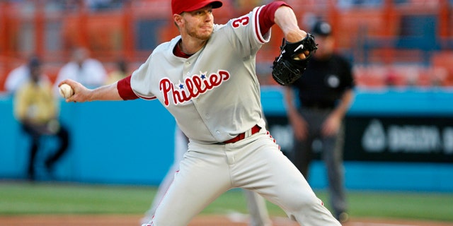 This May 29, 2010, file photo shows Philadelphia Phillies' Roy Halladay throwing a pitch during the first inning, enroute to a perfect game, against the Florida Marlins, in Miami.