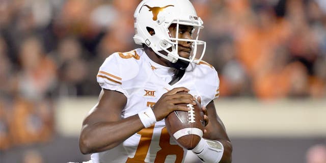 Nov 15, 2014; Stillwater, OK, USA; Texas Longhorns quarterback Tyrone Swoopes (18) looks down the field to pass against the Oklahoma State Cowboys during the first half at Boone Pickens Stadium. Mandatory Credit: Peter G. Aiken-USA TODAY Sports
