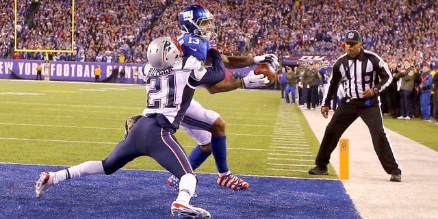 EAST RUTHERFORD, NJ - NOVEMBER 15: Odell Beckham #13 of the New York Giants cannot hold onto the ball which is broken up in the end zone by Malcolm Butler #21 of the New England Patriots in the fourth Quarter during their game at MetLife Stadium on November 15, 2015 in East Rutherford, New Jersey. (Photo by Al Bello/Getty Images)