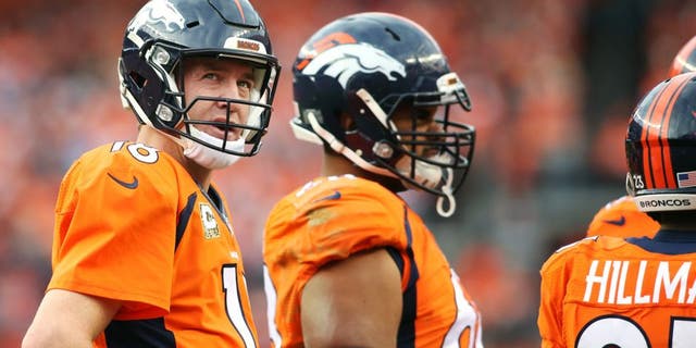 Nov 15, 2015; Denver, CO, USA; Denver Broncos quarterback Peyton Manning (18) looks on during the first half against the Kansas City Chiefs at Sports Authority Field at Mile High. Mandatory Credit: Chris Humphreys-USA TODAY Sports
