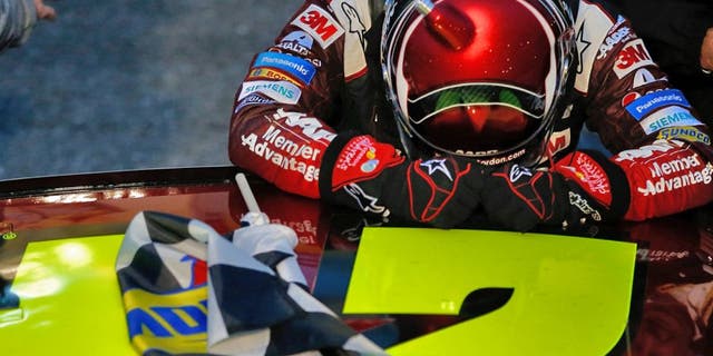 MARTINSVILLE, VA - NOVEMBER 01: Jeff Gordon, driver of the #24 AARP Member Advantages Chevrolet, pauses for a moment after winning the NASCAR Sprint Cup Series Goody's Headache Relief Shot 500 at Martinsville Speedway on November 1, 2015 in Martinsville, Virginia. (Photo by Todd Warshaw/NASCAR via Getty Images)