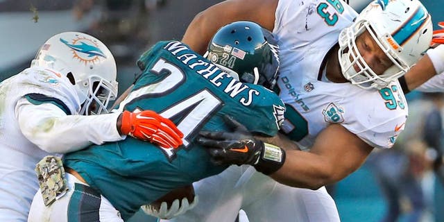 Miami Dolphins' Reshad Jones and Ndamukong Suh tackle Philadelphia Eagles' Ryan Mathews during the third quarter on Sunday, Nov. 15, 2015, at Lincoln Financial Field in Philadelphia. (Charles Trainor Jr./Miami Herald/TNS via Getty Images)