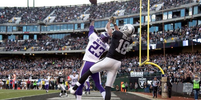 November 15, 2015; Oakland, CA, USA; Minnesota Vikings cornerback Terence Newman (23) intercepts the football intended for Oakland Raiders wide receiver Andre Holmes (18) during the fourth quarter at O.co Coliseum. The Vikings defeated the Raiders 30-14. Mandatory Credit: Kyle Terada-USA TODAY Sports
