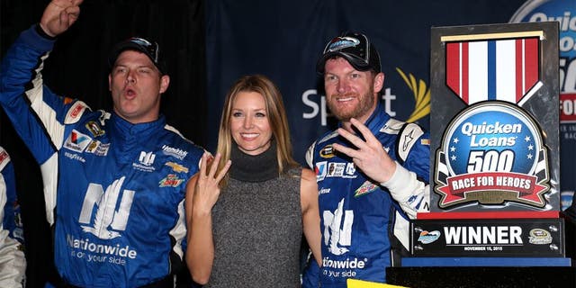 AVONDALE, AZ - NOVEMBER 15: (L-R) Amy Reimann celebrates with Dale Earnhardt Jr., driver of the #88 Nationwide Chevrolet, in victory lane after Earnhardt won the rain-shortened NASCAR Sprint Cup Series Quicken Loans Race for Heroes 500 at Phoenix International Raceway on November 15, 2015 in Avondale, Arizona. (Photo by Matt Sullivan/NASCAR via Getty Images)
