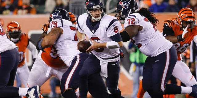 Houston Texans quarterback T.J. Yates (6) drops back to hand off in the second half of an NFL football game against the Cincinnati Bengals in Cincinnati, Monday, Nov. 16, 2015. (AP Photo/Frank Victores)