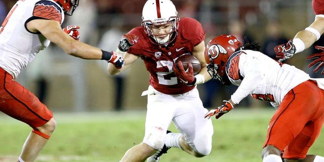 Nov 15, 2014; Stanford, CA, USA; Stanford Cardinal running back Christian McCaffrey (27) gains a few yards during double overtime against the Utah Utes at Stanford Stadium. Utah won 20-17 in overtime. Mandatory Credit: Bob Stanton-USA TODAY Sports