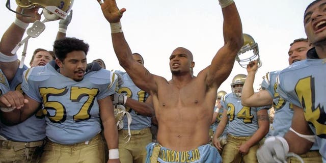 21 Nov 1998: Linebacker Brendon Ayanbadejo #50 of the UCLA Bruins celebrates during the game against the USC Trojans at the Rose Bowl in Pasadena, California. The Bruins defeated the Trojans 34-17. Mandatory Credit: Tom Hauck /Allsport