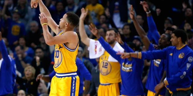 OAKLAND, CA - NOVEMBER 17: Stephen Curry #30 of the Golden State Warriors watches a three-point basket go in during their game against the Toronto Raptors at ORACLE Arena on November 17, 2015 in Oakland, California. NOTE TO USER: User expressly acknowledges and agrees that, by downloading and or using this photograph, User is consenting to the terms and conditions of the Getty Images License Agreement. (Photo by Ezra Shaw/Getty Images)