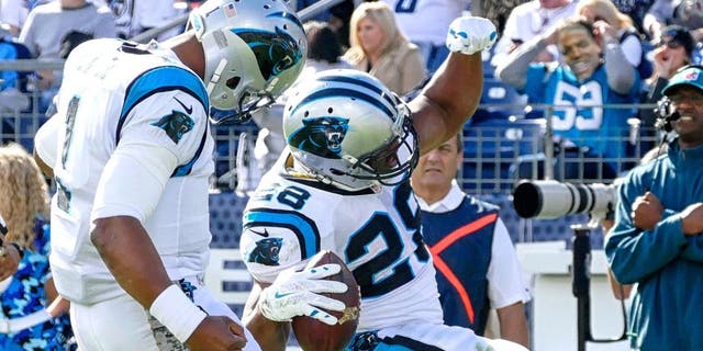 NASHVILLE, TN - NOVEMBER 15: Jonathan Stewart #28 of the Carolina Panthers celebrates with quarterback Cam Newton #1 after scoring a against the Tennessee Titans during the first half at Nissan Stadium on November 15, 2015 in Nashville, Tennessee. (Photo by Frederick Breedon/Getty Images)