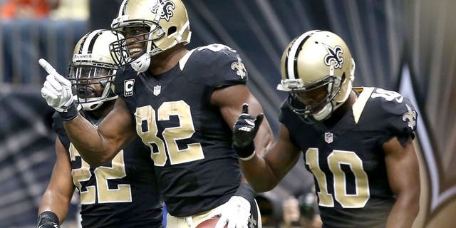 NEW ORLEANS, LA - NOVEMBER 01: Benjamin Watson #82 of the New Orleans Saints celebrates with Brandin Cooks #10 and Mark Ingram #22 after scoring a touchdown against the New York Giants at the Mercedes-Benz Superdome on November 1, 2015 in New Orleans, Louisiana. (Photo by Sean Gardner/Getty Images)