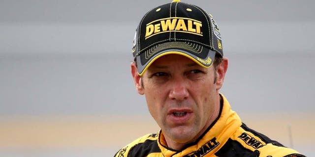 TALLADEGA, AL - OCTOBER 24: Matt Kenseth, driver of the #20 DeWalt Toyota, stands on the grid during qualifying for the NASCAR Sprint Cup Series CampingWorld.com 500 at Talladega Superspeedway on October 24, 2015 in Talladega, Alabama. (Photo by Chris Graythen/NASCAR via Getty Images)