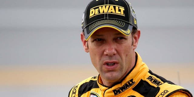 TALLADEGA, AL - OCTOBER 24: Matt Kenseth, driver of the #20 DeWalt Toyota, stands on the grid during qualifying for the NASCAR Sprint Cup Series CampingWorld.com 500 at Talladega Superspeedway on October 24, 2015 in Talladega, Alabama. (Photo by Chris Graythen/NASCAR via Getty Images)