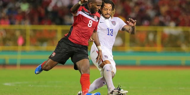 PORT OF SPAIN, TRINIDAD & TOBAGO - NOVEMBER 17: T&T's Khaleem Hyland battles to win the ball from USA's Jermaine Jones #13 during a World Cup Qualifier between Trinidad and Tobago and USA as part of the FIFA World Cup Qualifiers for Russia 2018 at Hasely Crawford Stadium on November 17, 2015 in Port of Spain, Trinidad & Tobago. (Photo by Ashley Allen Getty Images)