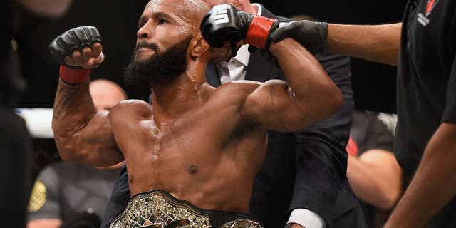 LAS VEGAS, NV - SEPTEMBER 05: Demetrious Johnson reacts after his victory over John Dodson in their flyweight championship bout during the UFC 191 event inside MGM Grand Garden Arena on September 5, 2015 in Las Vegas, Nevada. (Photo by Jeff Bottari/Zuffa LLC/Zuffa LLC via Getty Images)