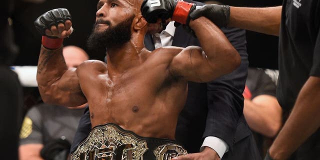 LAS VEGAS, NV - SEPTEMBER 05: Demetrious Johnson reacts after his victory over John Dodson in their flyweight championship bout during the UFC 191 event inside MGM Grand Garden Arena on September 5, 2015 in Las Vegas, Nevada. (Photo by Jeff Bottari/Zuffa LLC/Zuffa LLC via Getty Images)