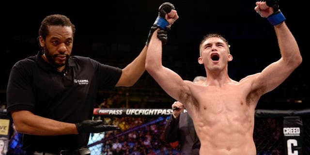 SAO PAULO, BRAZIL - NOVEMBER 07: Johnny Case of the United States celebrates victory over Yan Cabral of Brazil in their lightweight bout during the UFC Fight Night Belfort v Henderson at Ibirapuera Gymnasium on November 7, 2015 in Sao Paulo, Brazil. (Photo by Buda Mendes/Zuffa LLC/Zuffa LLC via Getty Images)