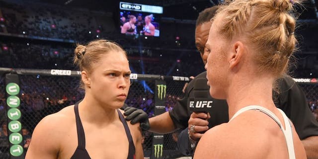 MELBOURNE, AUSTRALIA - NOVEMBER 15: (L-R) Ronda Rousey and Valerie Letourneau meet in the center of the Octagon before their UFC women's bantamweight championship bout during the UFC 193 event at Etihad Stadium on November 15, 2015 in Melbourne, Australia. (Photo by Josh Hedges/Zuffa LLC/Zuffa LLC via Getty Images)