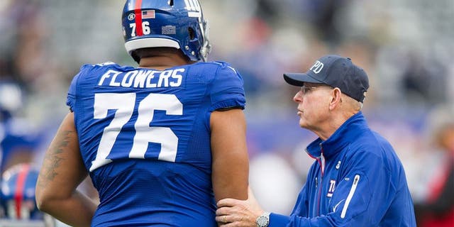 Oct 25, 2015; East Rutherford, NJ, USA; New York Giants head coach Tom Coughlin takes to offensive tackle Ereck Flowers (76) before the game against the Dallas Cowboys at MetLife Stadium. Mandatory Credit: William Hauser-USA TODAY Sports