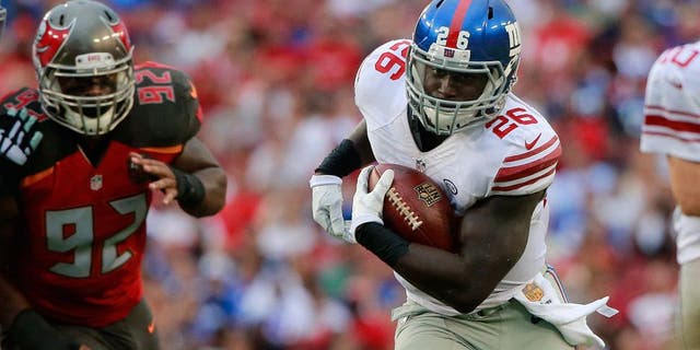 Nov 8, 2015; Tampa, FL, USA; New York Giants running back Orleans Darkwa (26) runs with the ball against the Tampa Bay Buccaneers during the first half at Raymond James Stadium. Mandatory Credit: Kim Klement-USA TODAY Sports