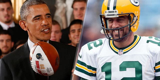 United States president Barack Obama tosses a national championship game ball gift during a ceremony honoring the 2014 NCAA football national champion Ohio State Buckeyes in the East Room at the White House. Mandatory Credit: Geoff Burke-USA TODAY Sports Green Bay Packers quarterback Aaron Rodgers (12) smiles before the game against the Carolina Panthers at Bank of America Stadium. Mandatory Credit: Jeremy Brevard-USA TODAY