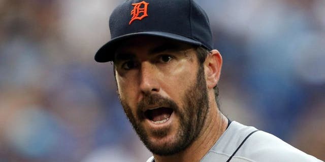 Jul 7, 2016; Toronto, Ontario, CAN; Detroit Tigers starting pitcher Justin Verlander (35) exchanges word with a teammate in the second inning during MLB game action against the Toronto Blue Jays at Rogers Centre. Blue Jays won 5-4.Mandatory Credit: Kevin Sousa-USA TODAY Sports