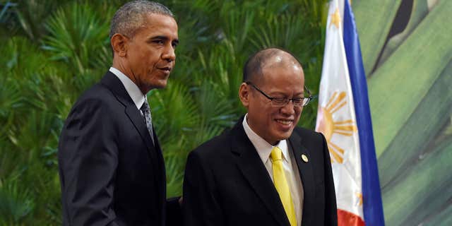 Nov. 18, 2015: President Barack Obama, left, and Philippines' President Benigno Aquino III, right, walk off of the stage after participating in a news conference in Manila, Philippines ahead of the start of the Asia-Pacific Economic Cooperation summit.