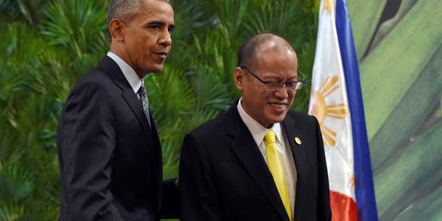 Nov. 18, 2015: President Barack Obama, left, and Philippines' President Benigno Aquino III, right, walk off of the stage after participating in a news conference in Manila, Philippines ahead of the start of the Asia-Pacific Economic Cooperation summit.
