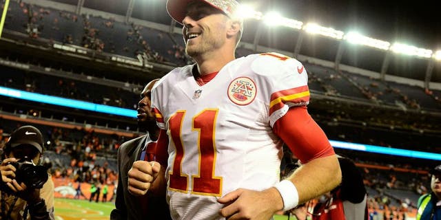 Nov 15, 2015; Denver, CO, USA; Kansas City Chiefs quarterback Alex Smith (11) celebrates the win over the Denver Broncos at Sports Authority Field at Mile High. The Chiefs defeated the Broncos 29-13. Mandatory Credit: Ron Chenoy-USA TODAY Sports