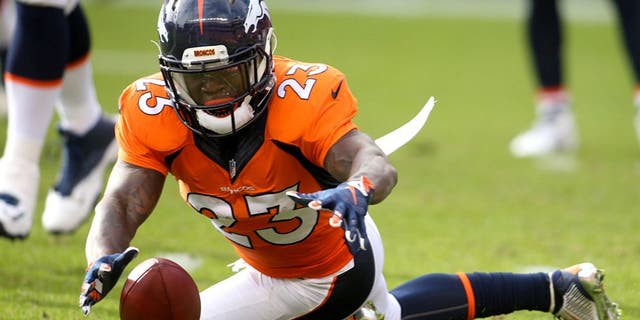 Nov 15, 2015; Denver, CO, USA; Denver Broncos running back Ronnie Hillman (23) dives to recover a fumble by quarterback Peyton Manning (not pictured) during the first half against the Kansas City Chiefs at Sports Authority Field at Mile High. Mandatory Credit: Chris Humphreys-USA TODAY Sports
