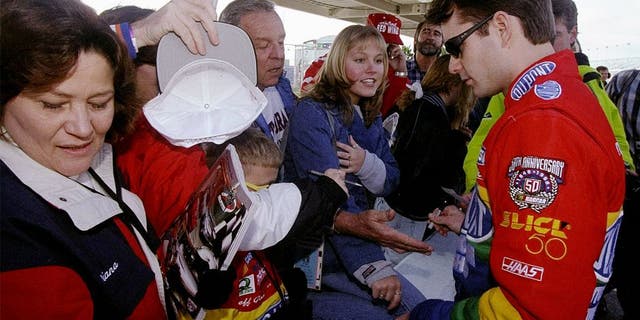 8 Feb 1998: Jeff Gordon signs autographs for fans during the Nascar Daytona 500 at the Daytona International Speedway in Daytona Beach, Florida. Mandatory Credit: David Taylor /Allsport