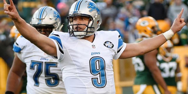 Nov 15, 2015; Green Bay, WI, USA; Detroit Lions quarterback Matthew Stafford (9) reacts after throwing a touchdown pass in the fourth quarter during the game against the Green Bay Packers at Lambeau Field. The Lions beat the Packers 18-16. Mandatory Credit: Benny Sieu-USA TODAY Sports