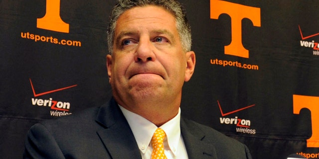 This Sept. 10, 2010, file photo shows University of Tennessee men's basketball coach Bruce Pearl grimacing during a news conference, where Pearl expresses remorse for giving misleading information to the NCAA during an investigation into the school's basketball program, in Knoxville, Tenn.