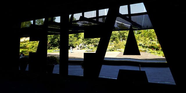 The FIFA logo made with mirrors is pictured at the FIFA headquarters on June 3, 2015 in Zurich. Blatter on June 2, 2015 resigned as president of FIFA as a mounting corruption scandal engulfed world football's governing body. The 79-year-old Swiss official, FIFA president for 17 years and only reelected on May 29, said a special congress would be called as soon as possible to elect a successor. AFP PHOTO / MICHAEL BUHOLZER (Photo credit should read MICHAEL BUHOLZER/AFP/Getty Images)
