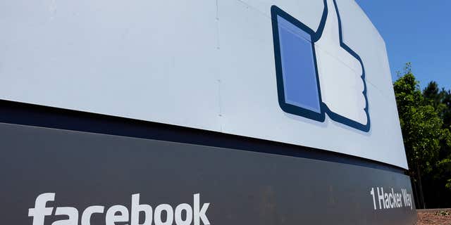 FILE - This July 16, 2013 file photo shows a sign at Facebook headquarters in Menlo Park, Calif. The heartache of a broken relationship may soon become less painful on Facebook.