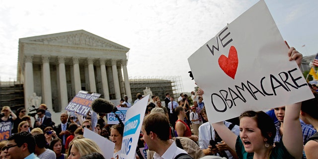 FILE: June 28, 2012: Supporters of President Barack Obama's health care law celebrate outside the Supreme Court in Washington, D.C.
