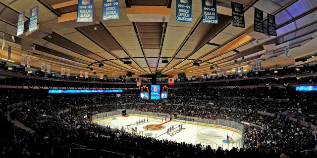 Oct. 15: The New York Rangers and the Toronto Maple Leafs line up for the singing of the each team's national anthems during opening night of the Rangers' NHL hockey season at Madison Square Garden in New York.