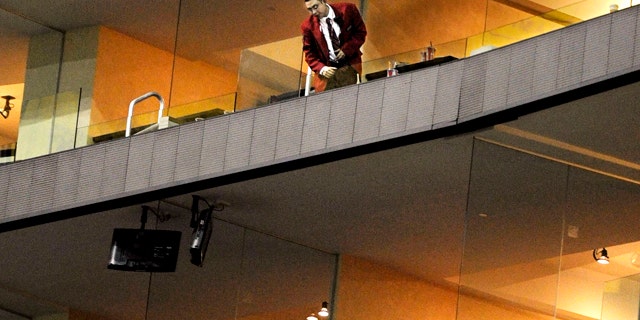Nov. 21: A security guard, top, looks down from where a young boy fell to where a second security guard stands following the Los Angeles Lakers' NBA basketball game against the Golden State Warriors at Staples Center in Los Angeles.