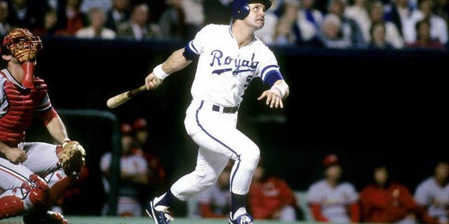 KANSAS CIT, MO - OCTOBER, 1985: Third baseman George Brett #5 swings and watches the flight of his ball against the St. Louis Cardinals in the World Series, October, 1985 at Royals Stadium in Kansas City, Missouri. The Royals won the series 4 games to 3. Brett played for the Royals from 1973-93. (Photo by Focus on Sport/Getty Images)